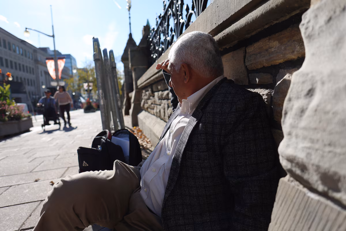 Afghan professor camps outside Parliament in despair over children facing deportation