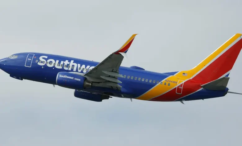 A Southwest plane had to abort its landing after a near miss with a helicopter crossing its path