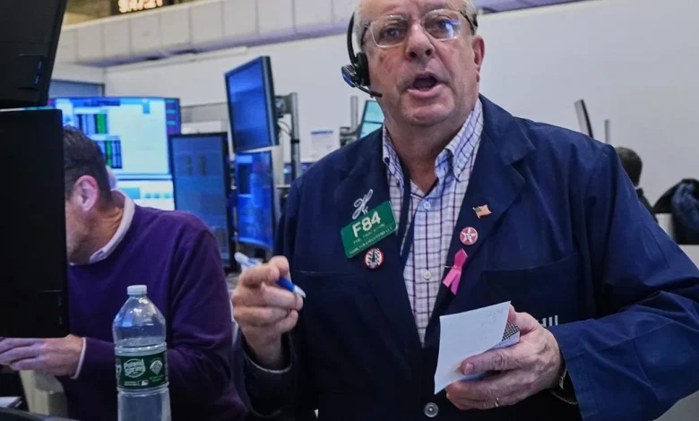 A fragile US stock market flips between gains and losses following its wildest day since April