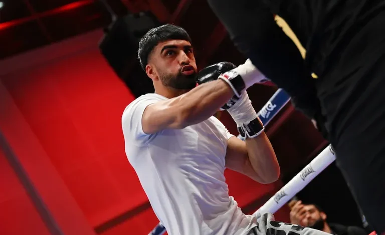 Adam Azim and Kurt Scoby almost come to blows during public workout