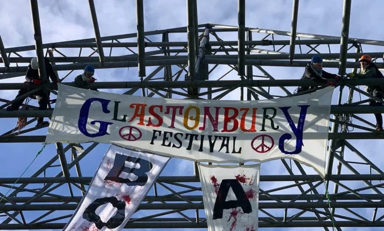Anti-genocide activists scale Glastonbury Pyramid Stage to demand festival drop Allianz