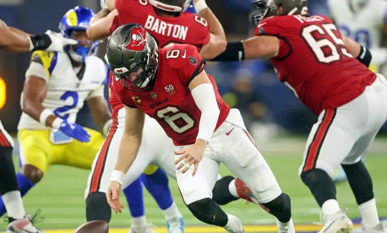 Are the Panthers now in 1st place in the NFC South after the Buccaneers' Week 12 loss?