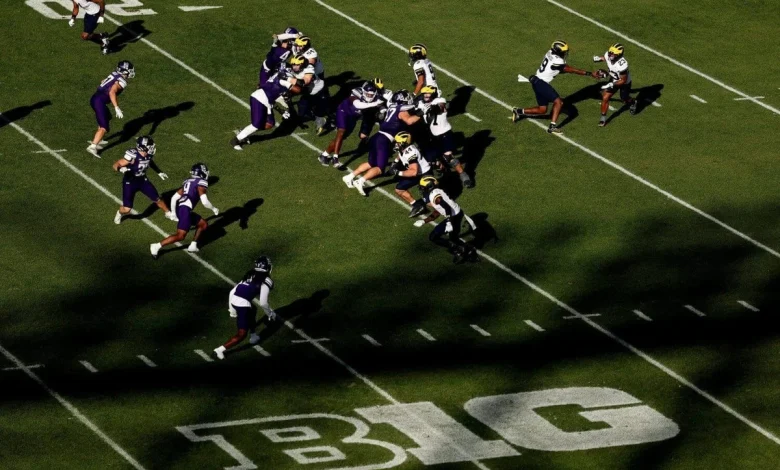 At Wrigley Field, Michigan’s long-running Big Ten animosity takes a day off