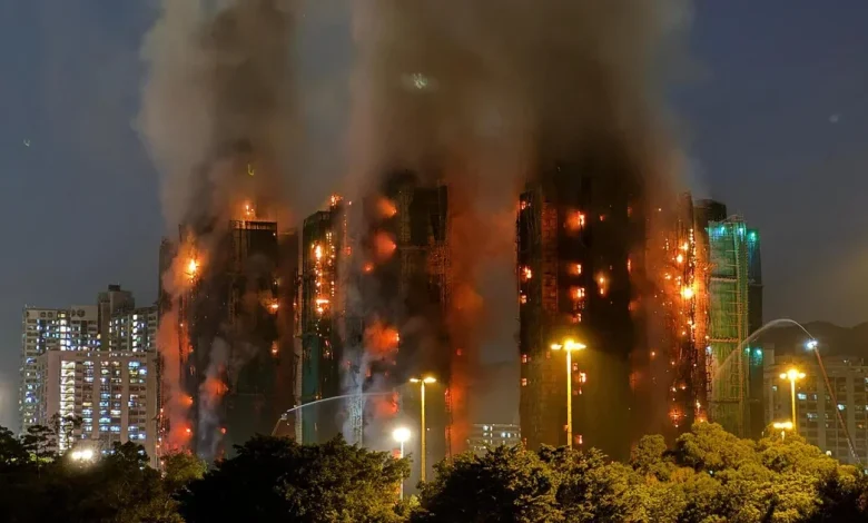At least 4 dead in blaze in Hong Kong residential high-rise complex with others trapped inside