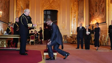 Bend a knee like Beckham: Soccer star is knighted by King Charles III