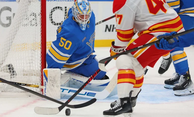 Binnington makes 38 saves, Blues edge Flames
