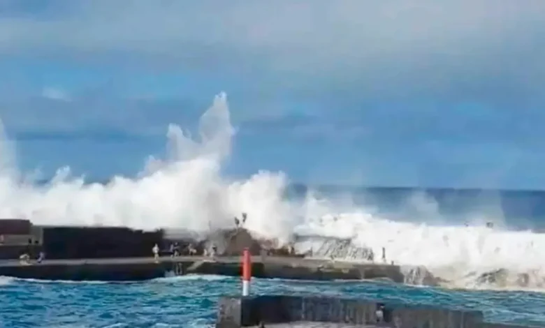 Brit holiday hotspot on 'red alert' as monster 15ft waves batter island after tourists swept out to sea & three killed