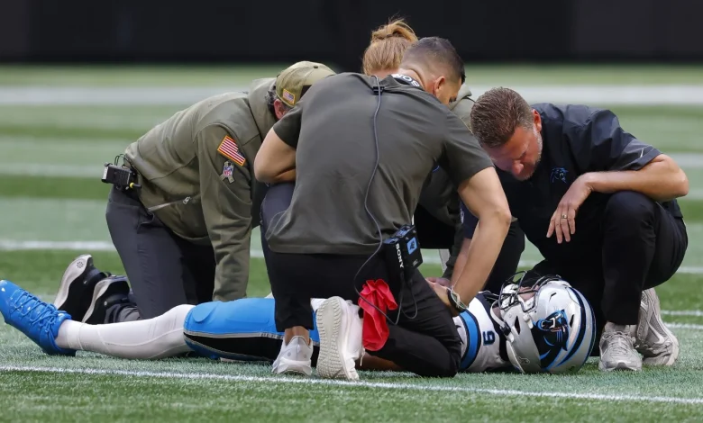 Bryce Young walks to locker room after going down hard on sack