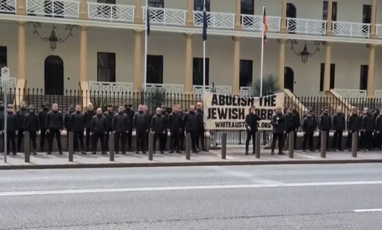 Calls for tougher laws after 'disgraceful' mistake allows neo-Nazi protest outside NSW parliament to slip through cracks