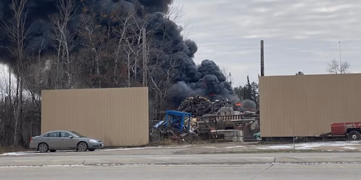 Car explosion leads to large fire at salvage yard in Clinton Township