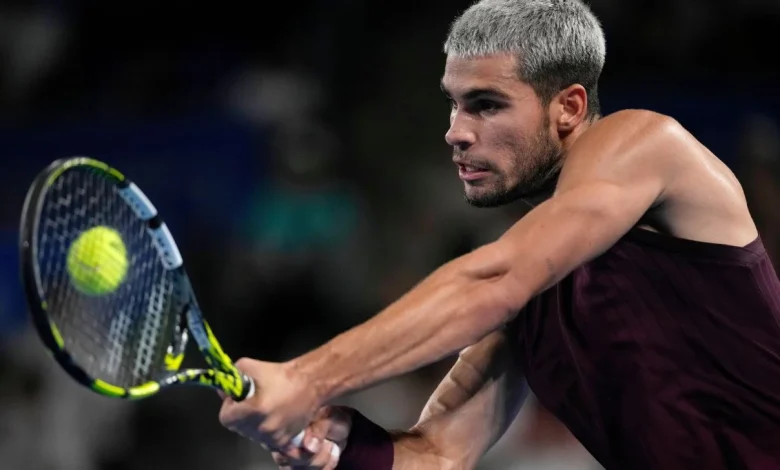 Carlos Alcaraz lifts trophy as year-end No. 1 player