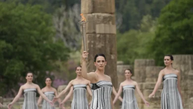 Cross-country skiing legend Stefania Belmondo presents, Greek alpine skier AJ Ginnis first torchbearer: the first secrets of the Milan/Cortina 2026 Olympic flame lighting ceremony revealed