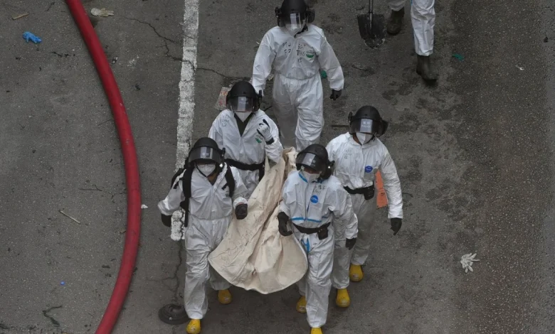 Death toll in Hong Kong apartment complex blaze rises to 146 as the city mourns