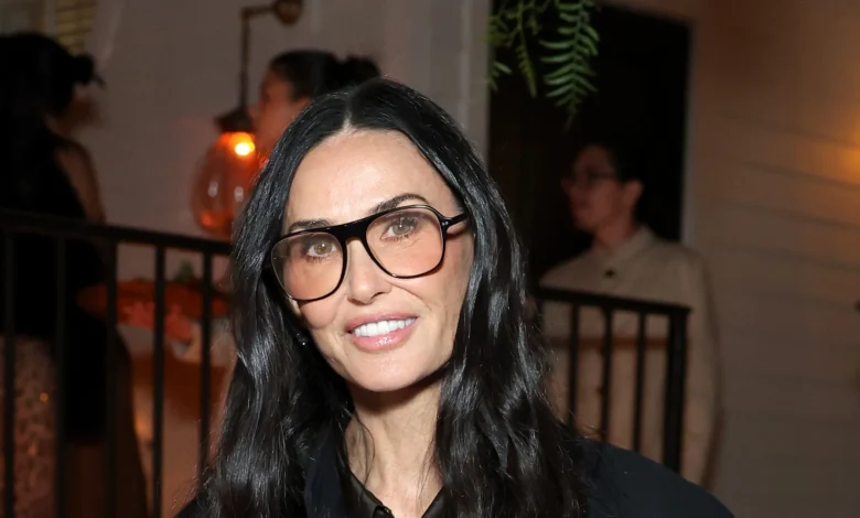Demi Moore embraces the heritage trend in a cosy argyle jumper, tartan pleated skirt and knee-high boots