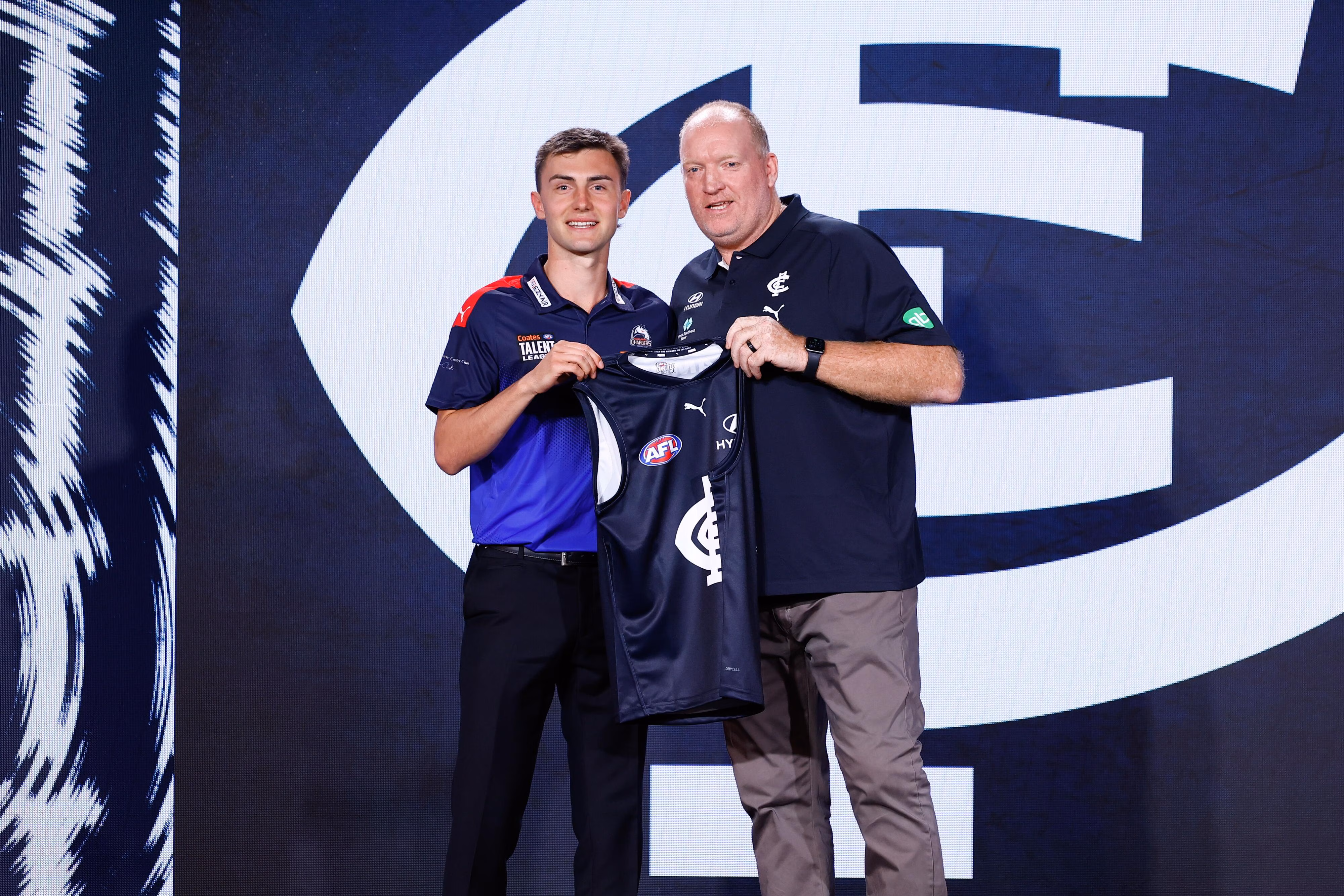 Family, legends, coaches among jumper presenters at draft