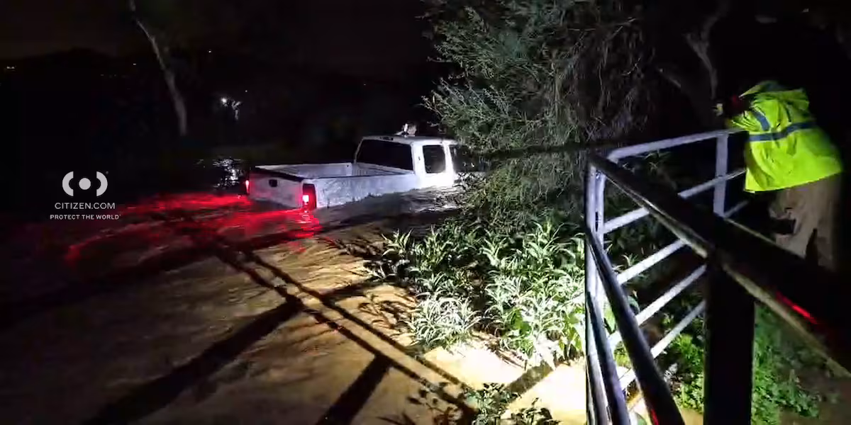 Fire crews rescue driver trapped in floodwaters in north Phoenix