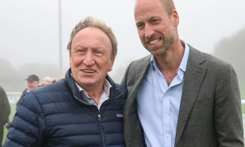 Football legend Neil Warnock poses for a photo with 'fan' Prince William after royal helped stranded local football club