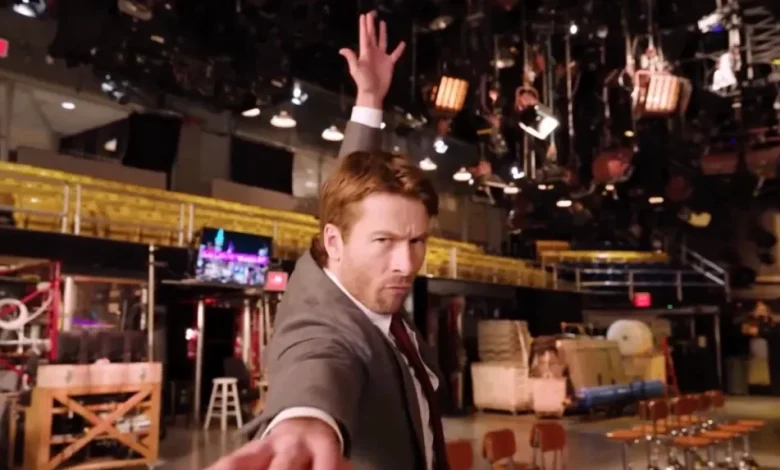 Glen Powell Channels Christopher Walken Getting Into The Groove For ‘SNL’ Hosting Duty, With One Small Accident
