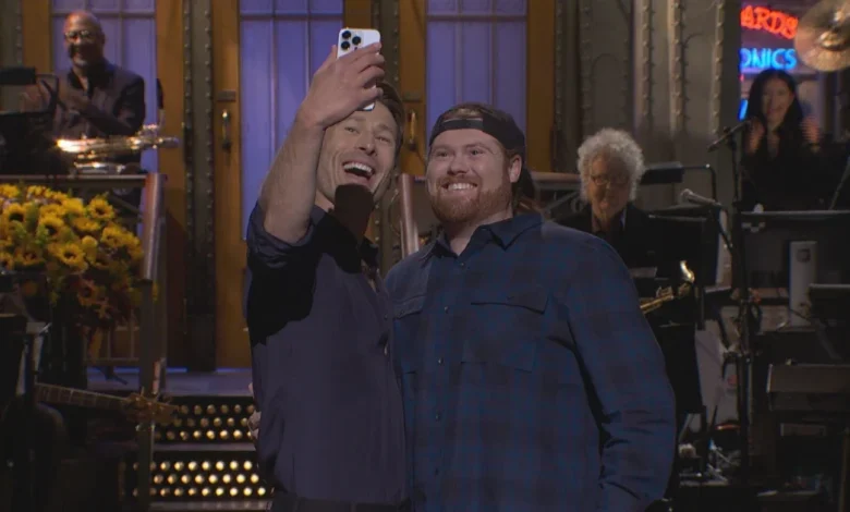 Glen Powell brings ‘Mitch the UPS guy’ onto ‘SNL’ stage after waiting 4 years to host