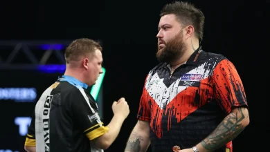 Grand Slam of Darts 2025: Michael Smith sets up showdown with Luke Humphries after surviving 11 match darts from Chris Dobey
