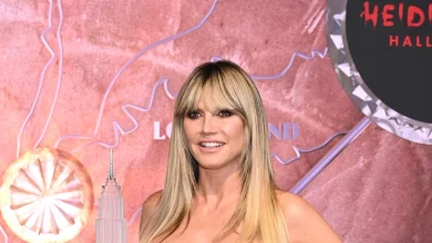 Heidi Klum braves the New York rain in vampy all-leather look for Halloween event - watch