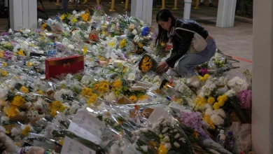 Hong Kong mourns those lost to fire as investigators search for remains