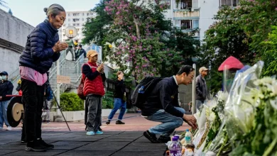 Hong Kong mourns victims of blaze as search for remains continues