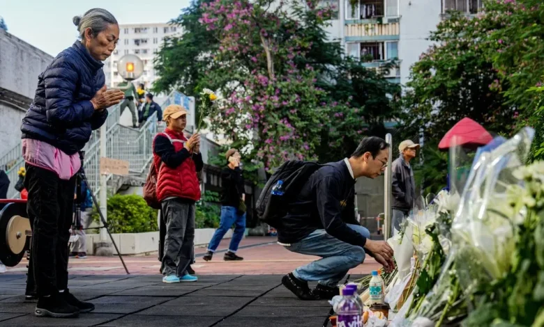 Hong Kong mourns victims of blaze as search for remains continues