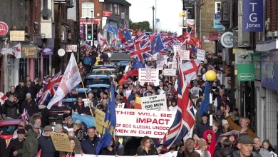 Hundreds march through Sussex town over asylum camp plans | ITV News