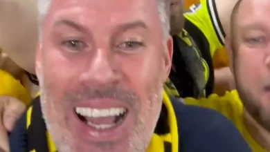 Jamie Carragher says 'they are giving me beers' as he marches with Dortmund fans