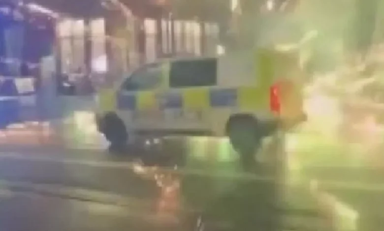 Moment firework explodes in front of police officer during city centre mayhem