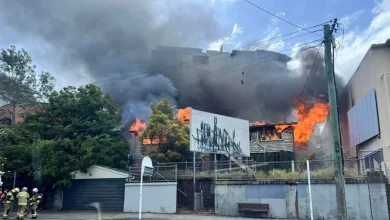 Multiple crews fighting house fire next to Brisbane cinema