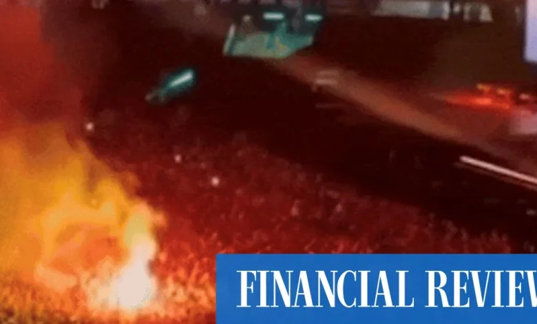 Oasis frontman unleashes after flares thrown into crowd