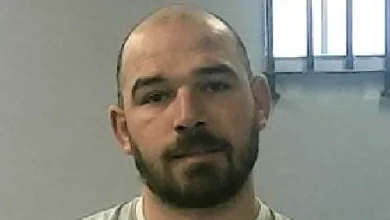 One of two prisoners mistakenly released hands himself in