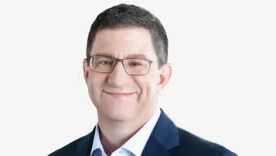 PVH’s Zac Coughlin Stepping Down as CFO in Jump to SiriusXM