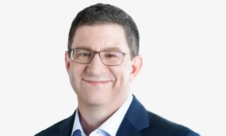 PVH’s Zac Coughlin Stepping Down as CFO in Jump to SiriusXM