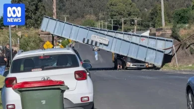 Passenger trapped after bridge collapses in truck crash