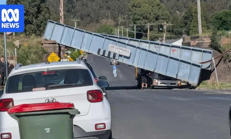 Passenger trapped after bridge collapses in truck crash