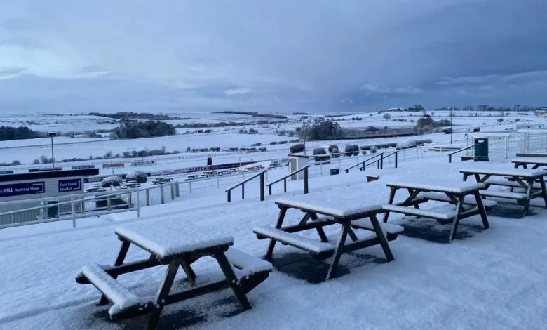 Racing abandoned at Britain's most scenic racecourse as thick blanket of snow covers track amid weather warning