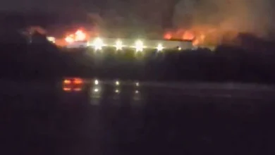 Raging fire tears through building as 'explosions' heard from miles away