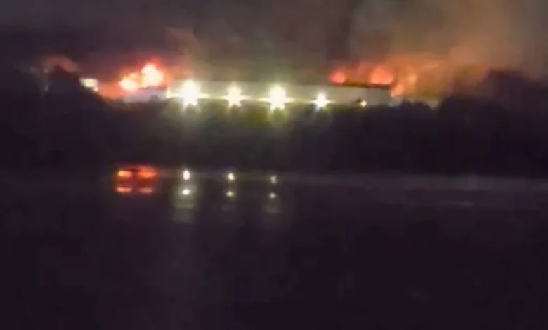 Raging fire tears through building as 'explosions' heard from miles away
