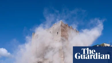 Rescuers try to free man trapped in partly collapsed medieval tower in Rome