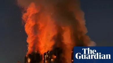 Several people trapped as fire engulfs residential complex in Hong Kong – video