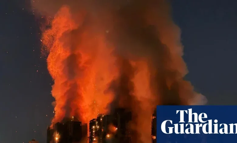 Several people trapped as fire engulfs residential complex in Hong Kong – video