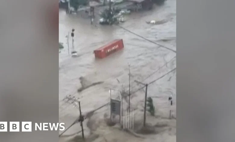 Shipping containers swept away in deadly Philippines floods