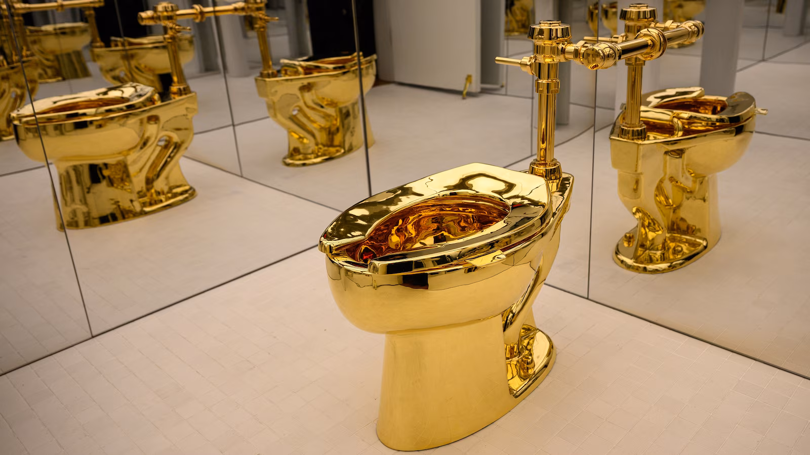Solid gold toilet named 'America' sells at auction for $12M