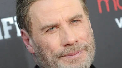 Travolta as Santa sings 'Greased Lightnin'' in Capital One commercial