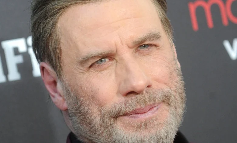 Travolta as Santa sings 'Greased Lightnin'' in Capital One commercial