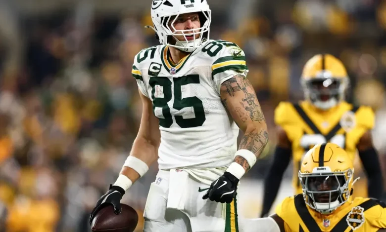 Tucker Kraft carted to locker room with knee injury