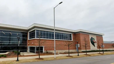 Two Alabama football players hospitalized and teammate detained, school says